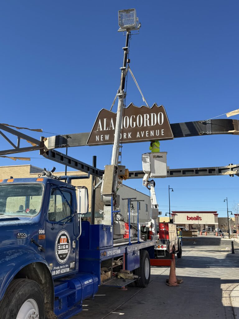EEI Sign Co. Lift Truck Installing Sign.